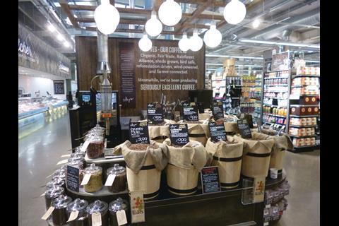 The retailer uses wooden displays to create a market feel throughout the spacious store